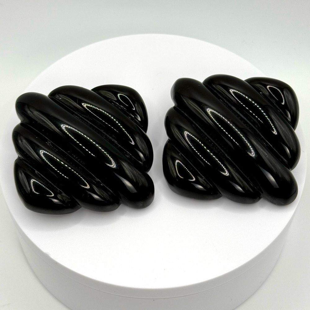 Vintage carved black Bakelite clip on earrings